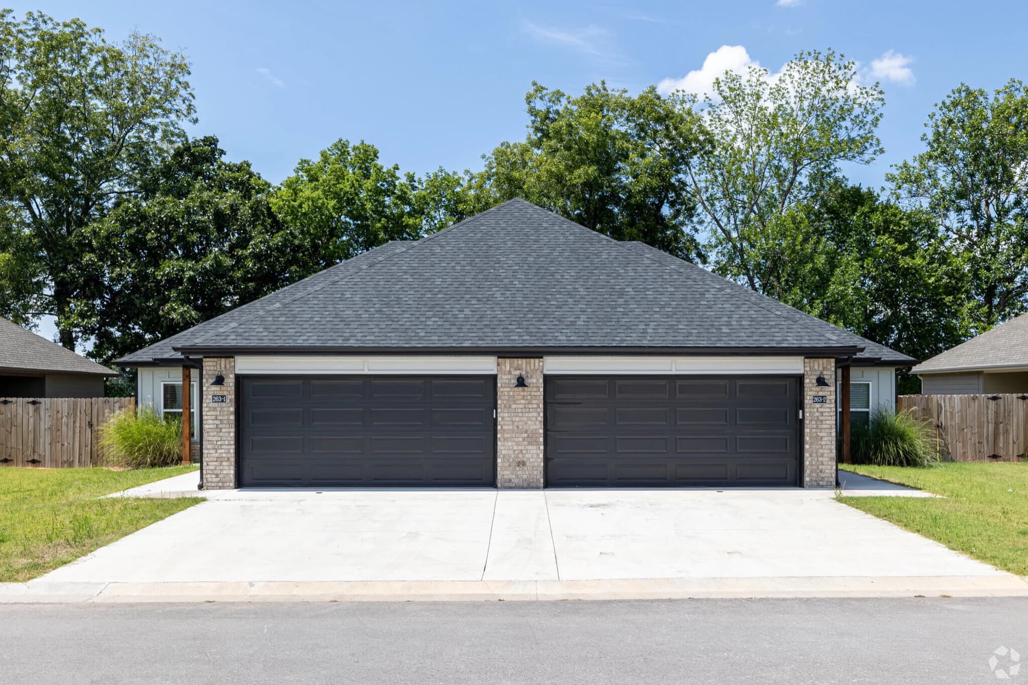 Newly built brick duplex seen from the street